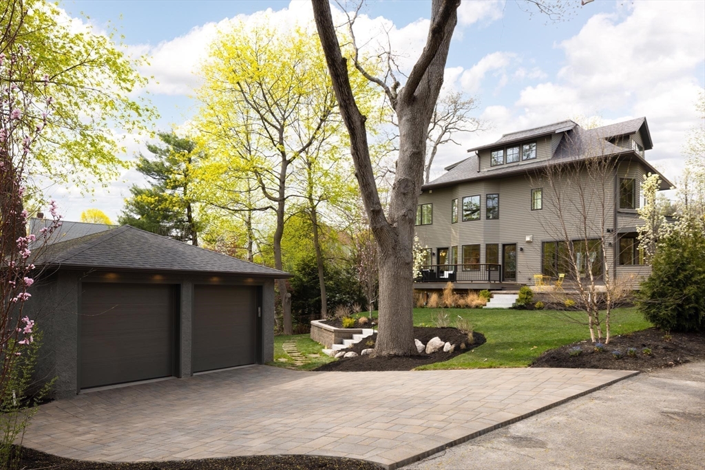 15 Woodcliff Road Newton, MA 02461 - Photo 25 of 27 a view of a house with a yard and plants