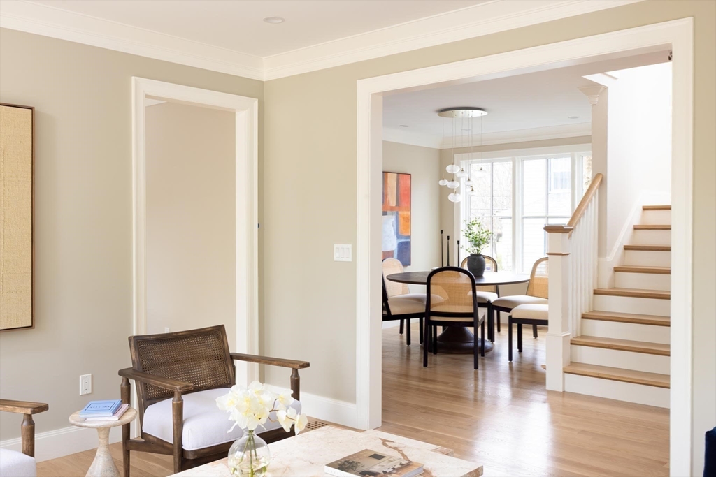 15 Woodcliff Road Newton, MA 02461 - Photo 4 of 27 a dining room with furniture wooden floor and a rug