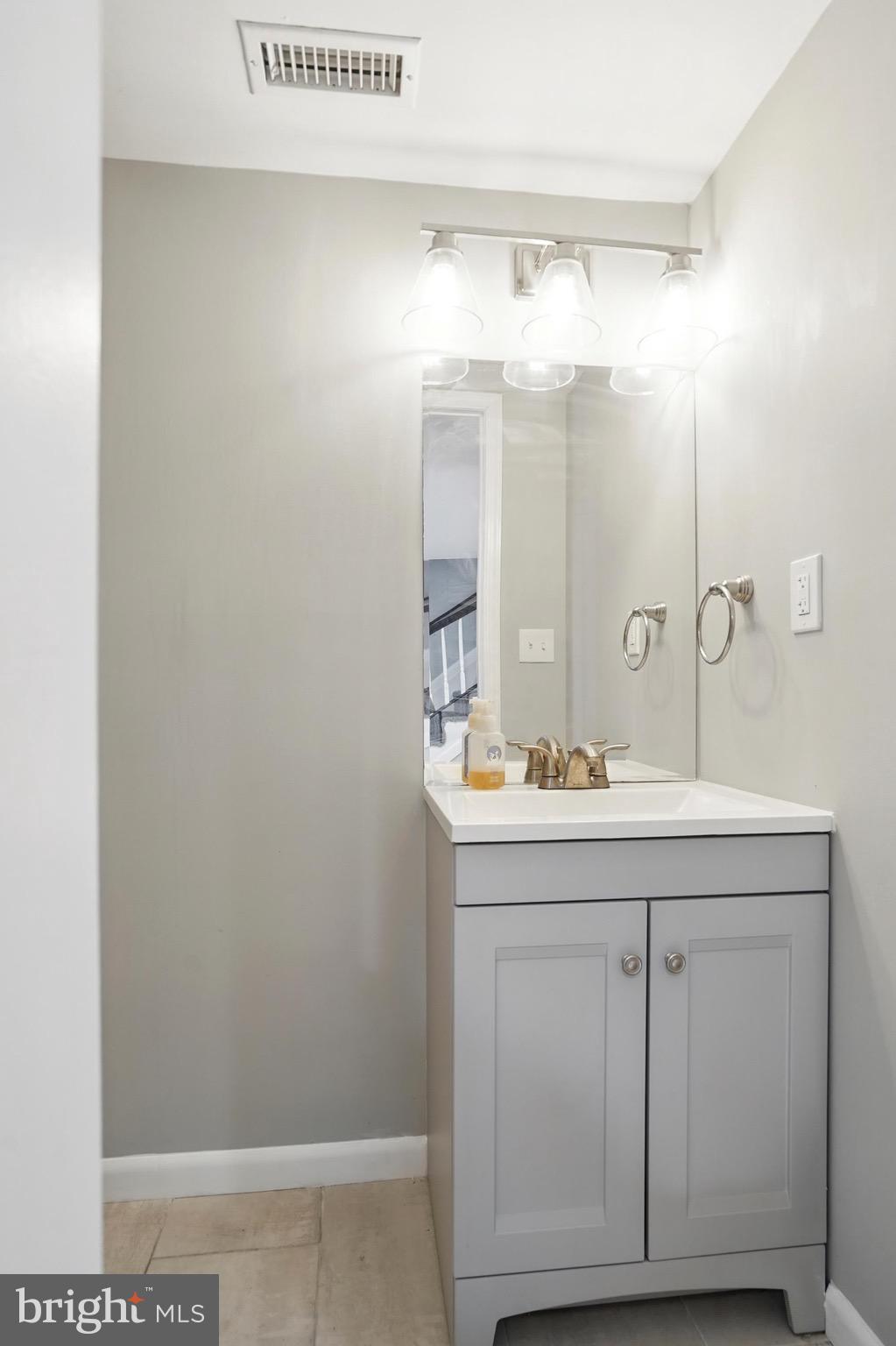 7812 Jamesford Road Dundalk, MD 21222 - Photo 18 of 30 a bathroom with a sink and a mirror