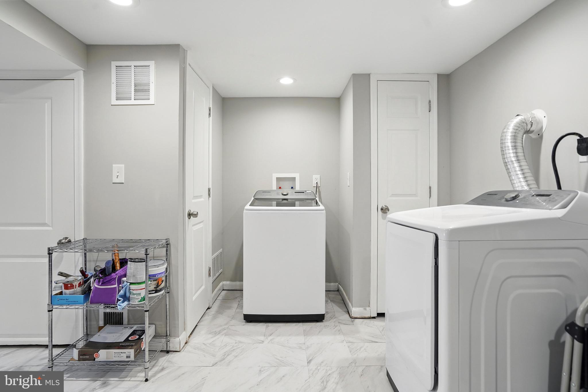7812 Jamesford Road Dundalk, MD 21222 - Photo 20 of 30 a utility room with sink dryer and washer
