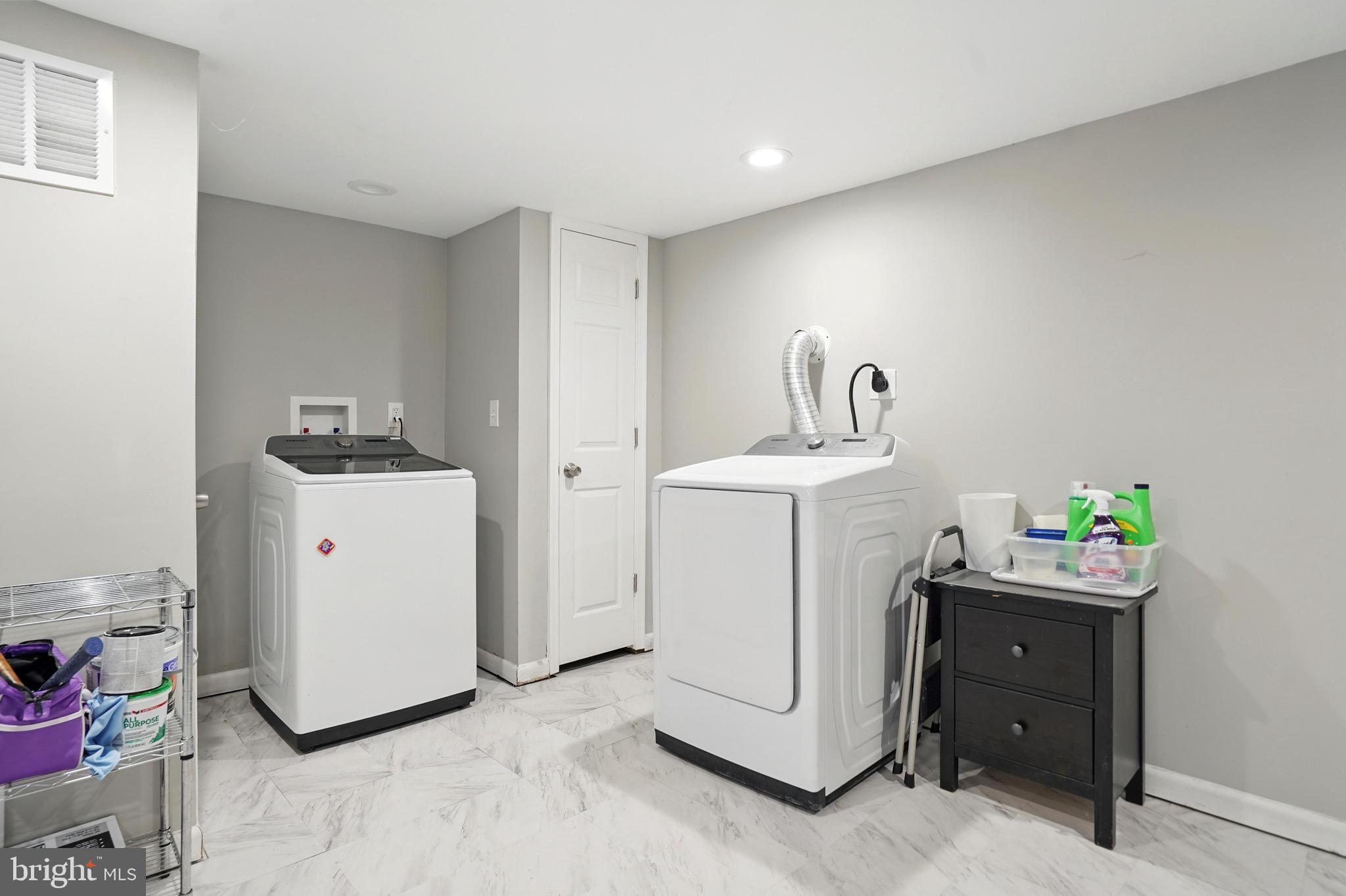 7812 Jamesford Road Dundalk, MD 21222 - Photo 21 of 30 a utility room with closet dryer and washer
