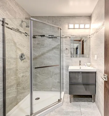 a bathroom with a sink and mirror