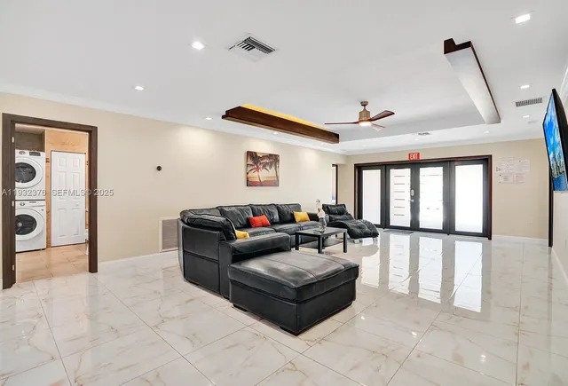 a living room with furniture and a window