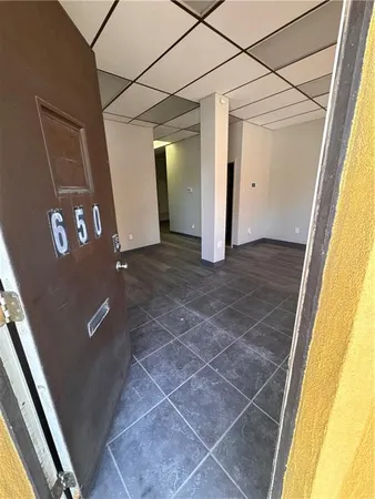 a kitchen with stainless steel appliances kitchen island granite countertop a refrigerator and a stove