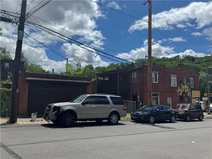 a view of a car parked in front of a building