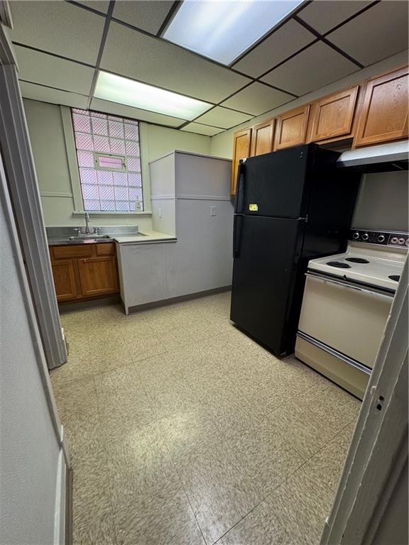 650 Ardmore Boulevard Pittsburgh, PA 15221 - Photo 13 of 48 a kitchen with stainless steel appliances kitchen island granite countertop a refrigerator and a stove