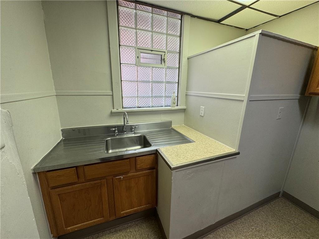 650 Ardmore Boulevard Pittsburgh, PA 15221 - Photo 14 of 48 a kitchen with a sink and a refrigerator