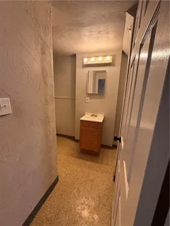 a bathroom with a sink a mirror and a toilet