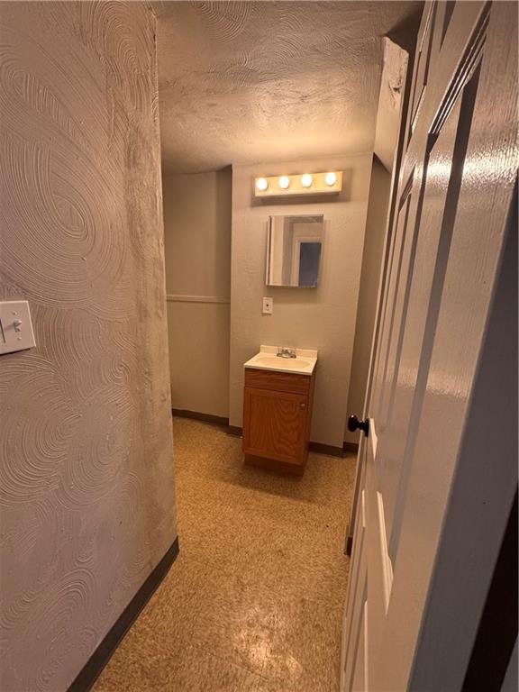 650 Ardmore Boulevard Pittsburgh, PA 15221 - Photo 16 of 48 a bathroom with a sink a mirror and a toilet