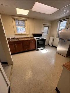 a kitchen with furniture and a fireplace