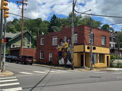 a front view of a building with street view