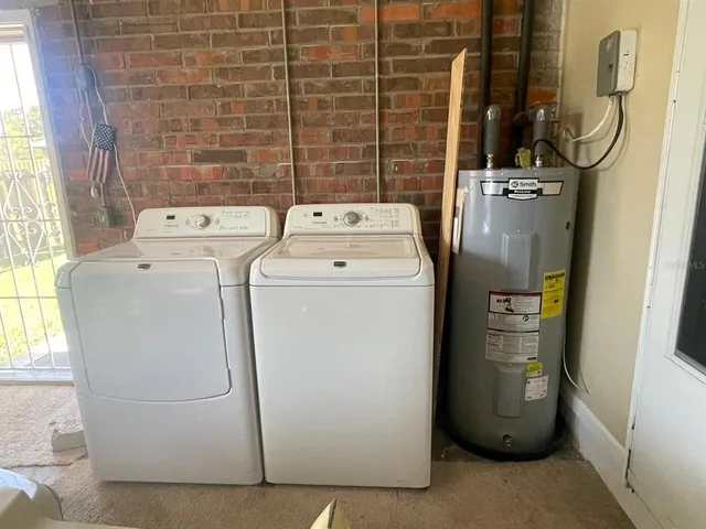 a utility room with dryer and washer