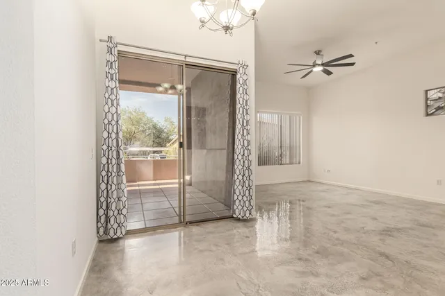 a kitchen with stainless steel appliances granite countertop a refrigerator a stove and a sink