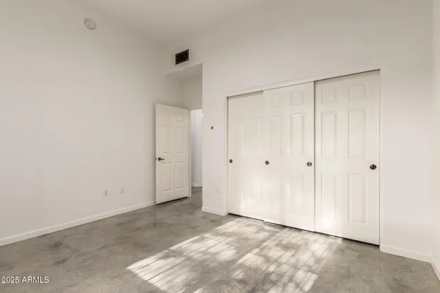 a bathroom with a sink a toilet a shower and a mirror