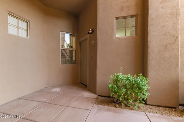 a view of an entryway with wooden floor and a window