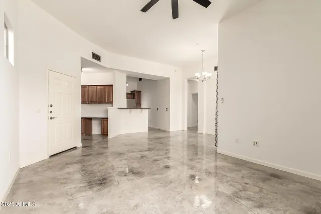 a kitchen with granite countertop a sink and cabinets