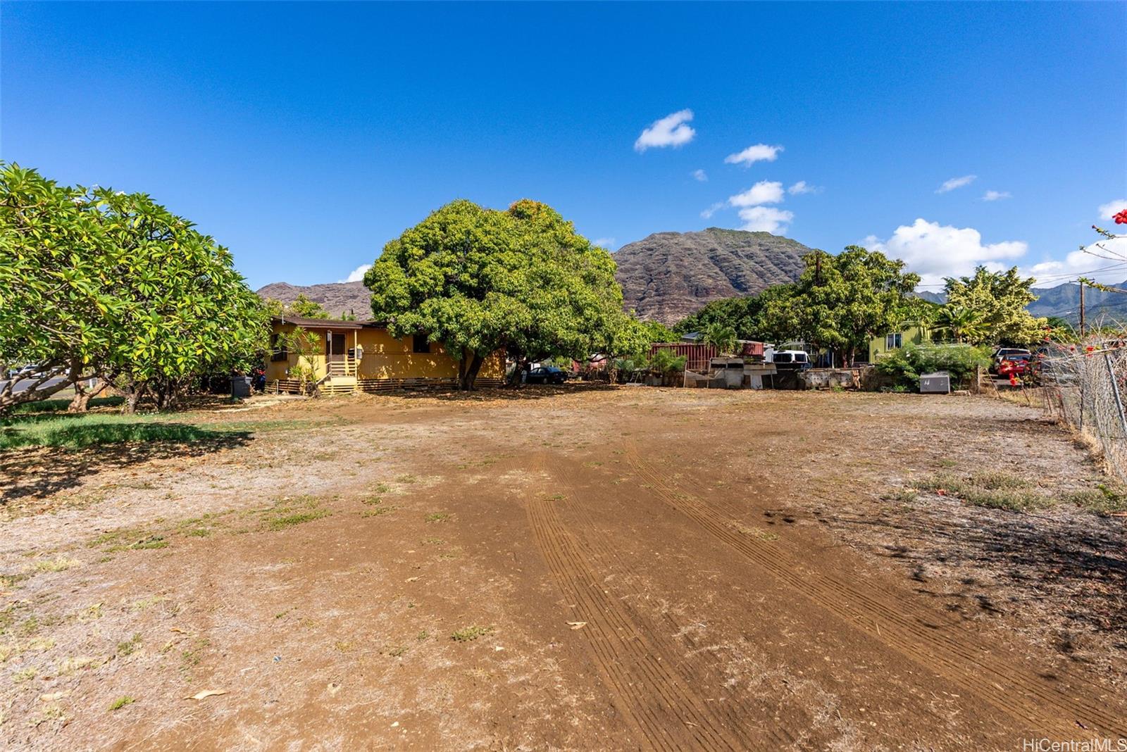 84-856 Lahaina Street, Unit C Waianae, HI 96792 - Photo 2 of 12 a view of a street with a building in the background
