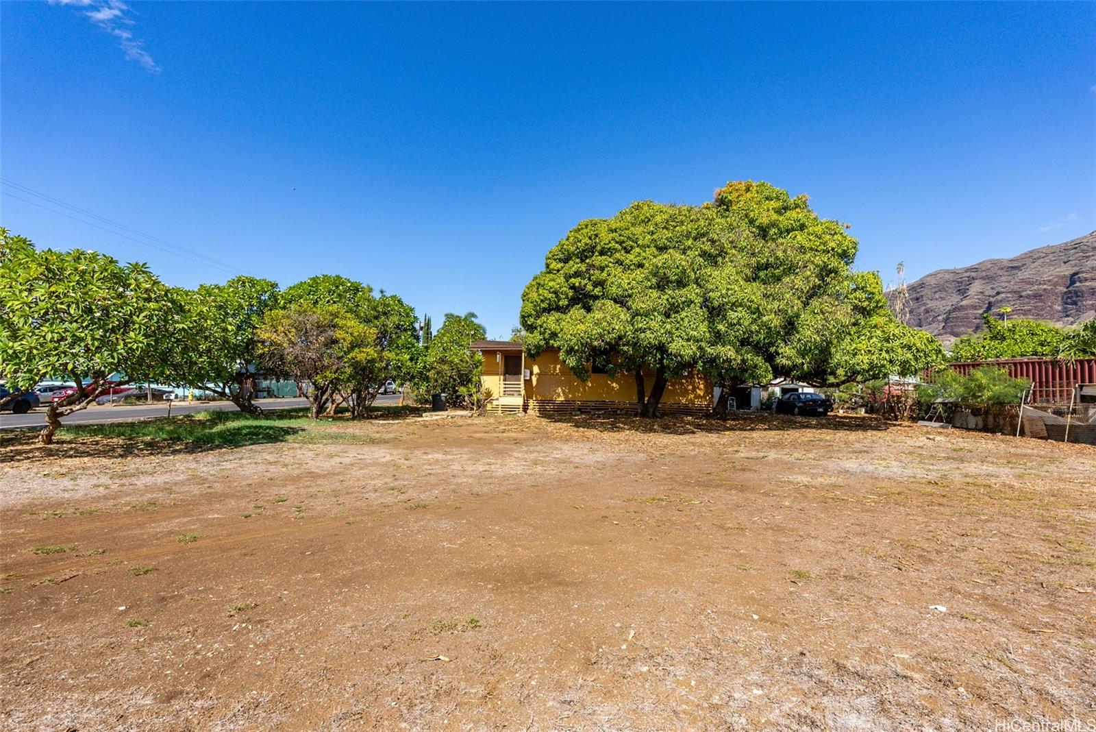 84-856 Lahaina Street, Unit C Waianae, HI 96792 - Photo 6 of 12 a backyard of a house with a tree