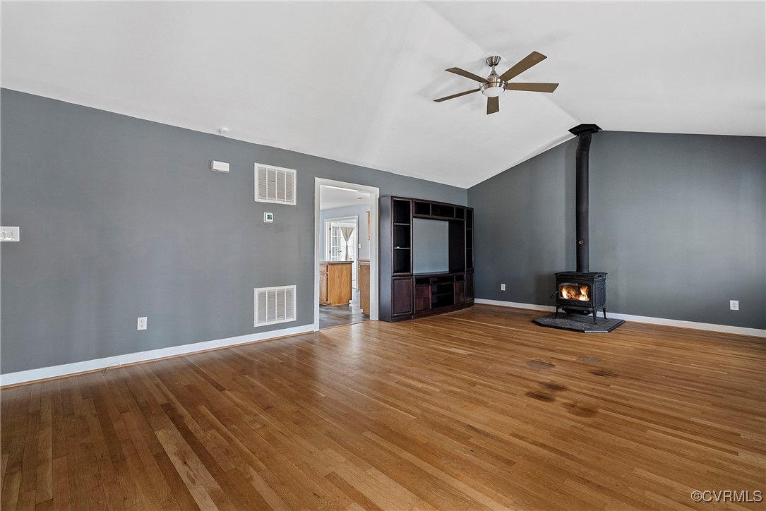 4350 Broadstreet Road Gum Spring, VA 23065 - Photo 11 of 48 a view of a livingroom with a flat screen tv and kitchen view