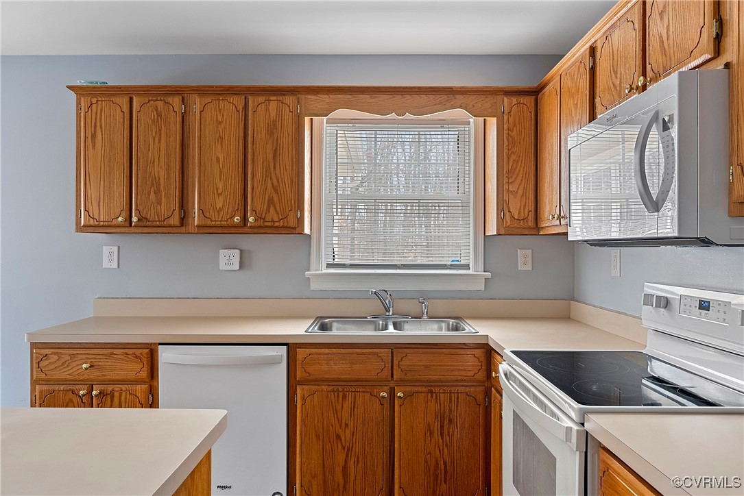 4350 Broadstreet Road Gum Spring, VA 23065 - Photo 17 of 48 a kitchen with stainless steel appliances granite countertop a sink a stove and cabinets