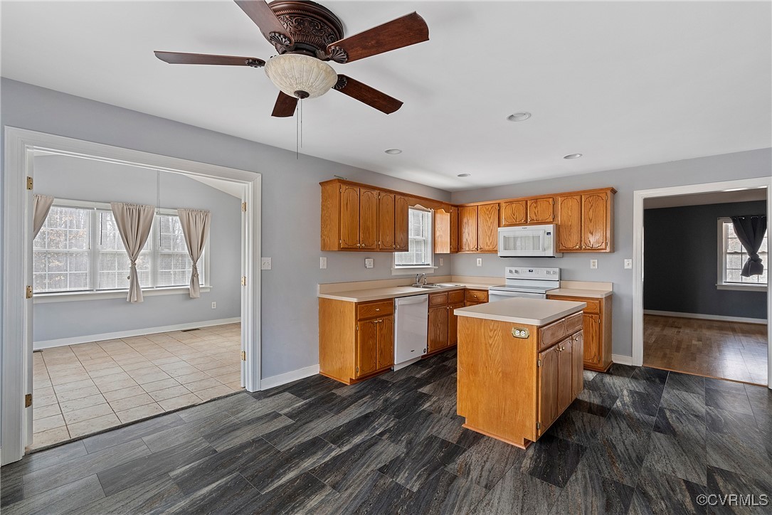 4350 Broadstreet Road Gum Spring, VA 23065 - Photo 19 of 48 a kitchen with a stove top oven cabinets and a wooden floor