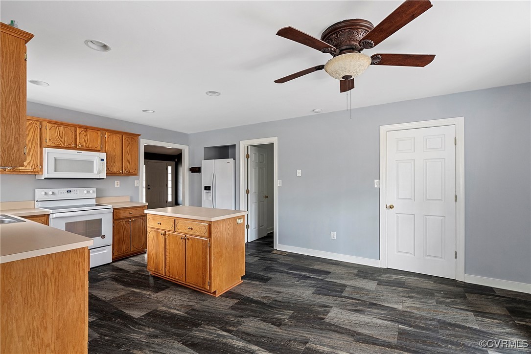 4350 Broadstreet Road Gum Spring, VA 23065 - Photo 21 of 48 a kitchen with a stove cabinets and wooden floor