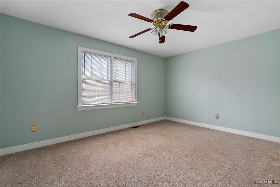 4350 Broadstreet Road Gum Spring, VA 23065 - Photo 28 of 48 an empty room with a window and a fan