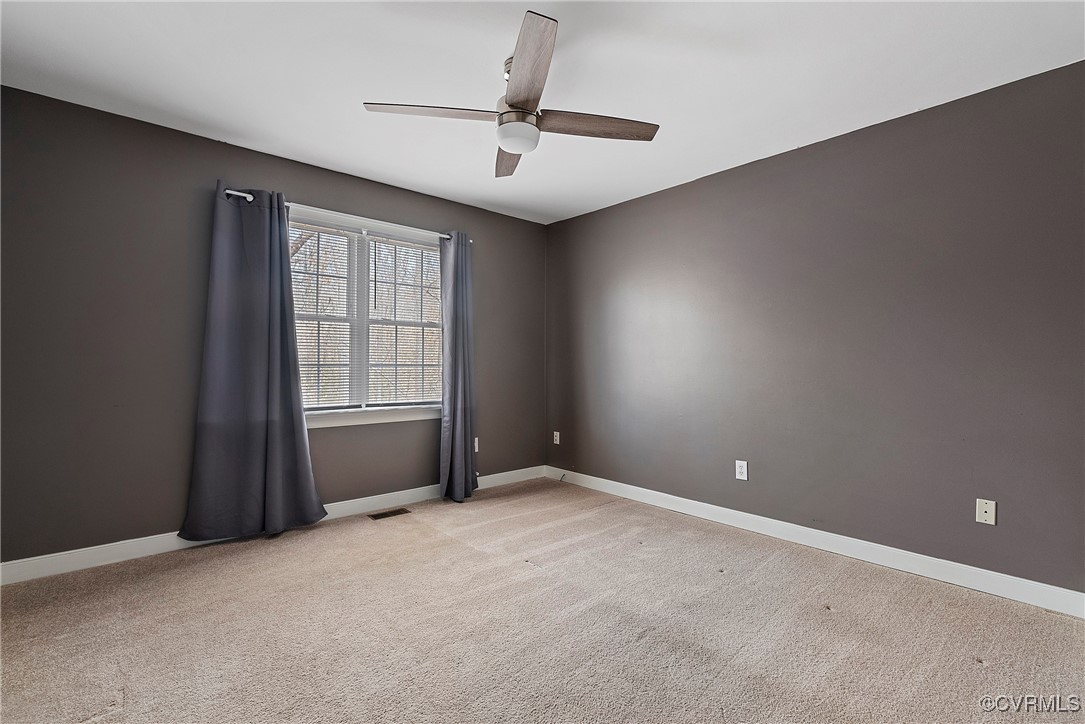 4350 Broadstreet Road Gum Spring, VA 23065 - Photo 30 of 48 an empty room with windows and ceiling fan
