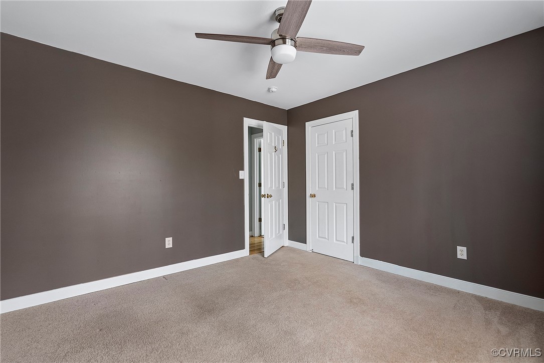 4350 Broadstreet Road Gum Spring, VA 23065 - Photo 31 of 48 an empty room with a ceiling fan and a chandelier fan