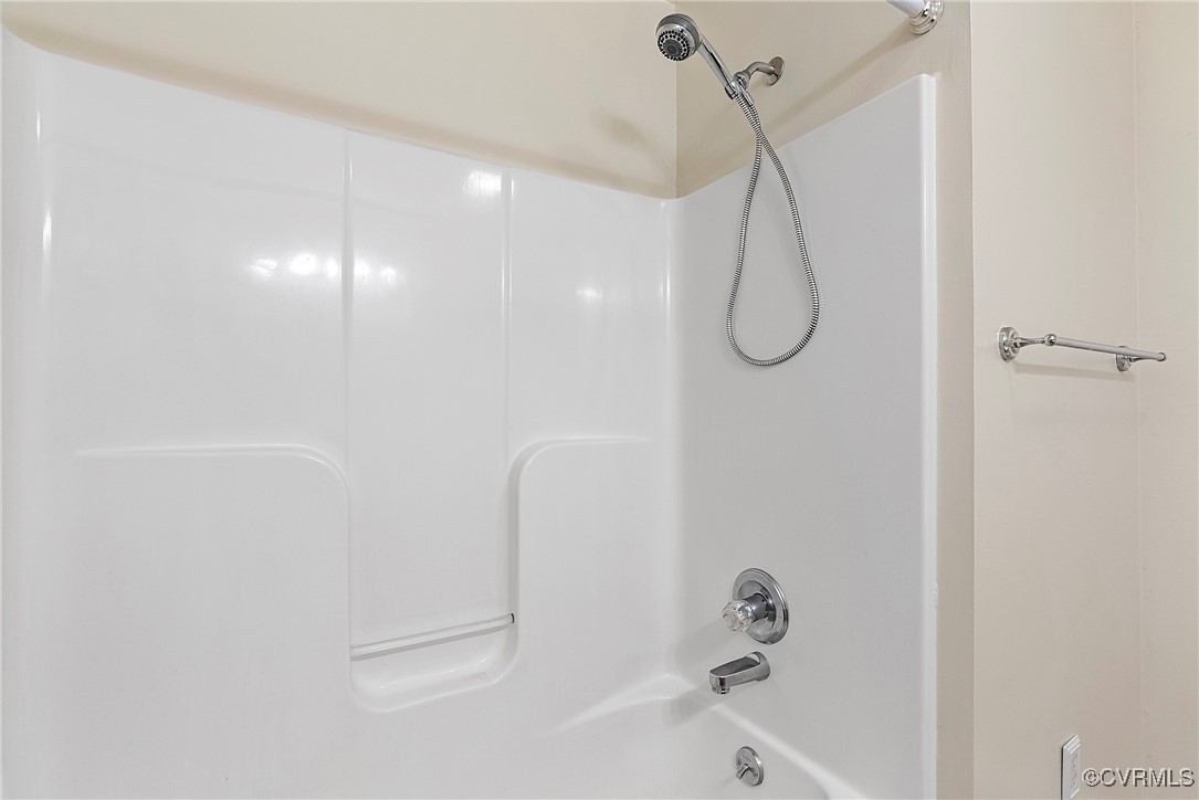 4350 Broadstreet Road Gum Spring, VA 23065 - Photo 34 of 48 a bathroom with a bath tub with a shower