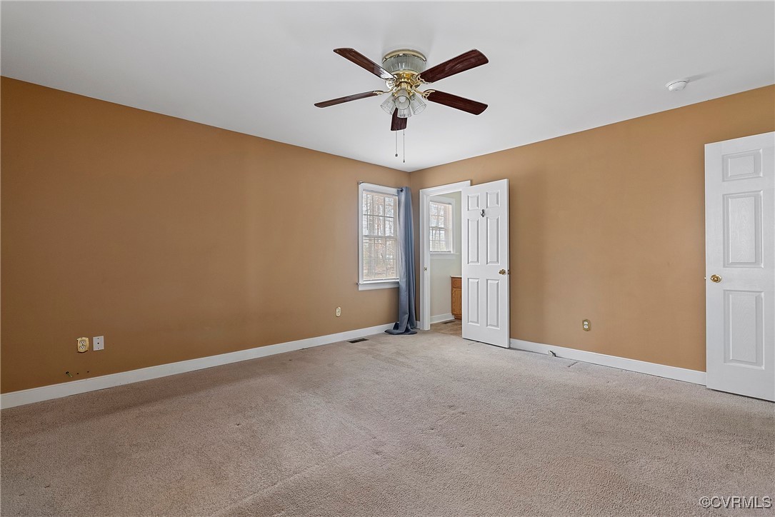 4350 Broadstreet Road Gum Spring, VA 23065 - Photo 36 of 48 an empty room with ceiling fan and window