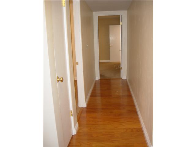 3122 Roadrunner Road San Marcos, CA 92078 - Photo 9 of 24 Hall, shown here, and entry also have beautiful dark oak colored hardwood flooring
