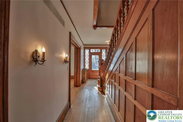 a view of staircase with wooden floor and stairs