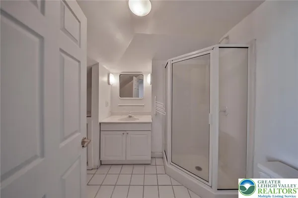 a kitchen with kitchen island a sink a stove and a refrigerator