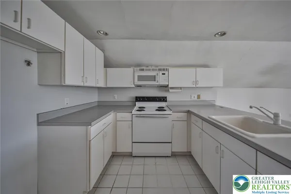 a view of kitchen and windows