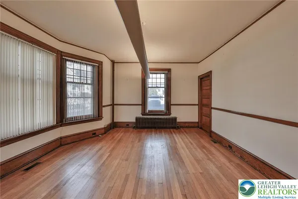 a view of front door with wooden floor