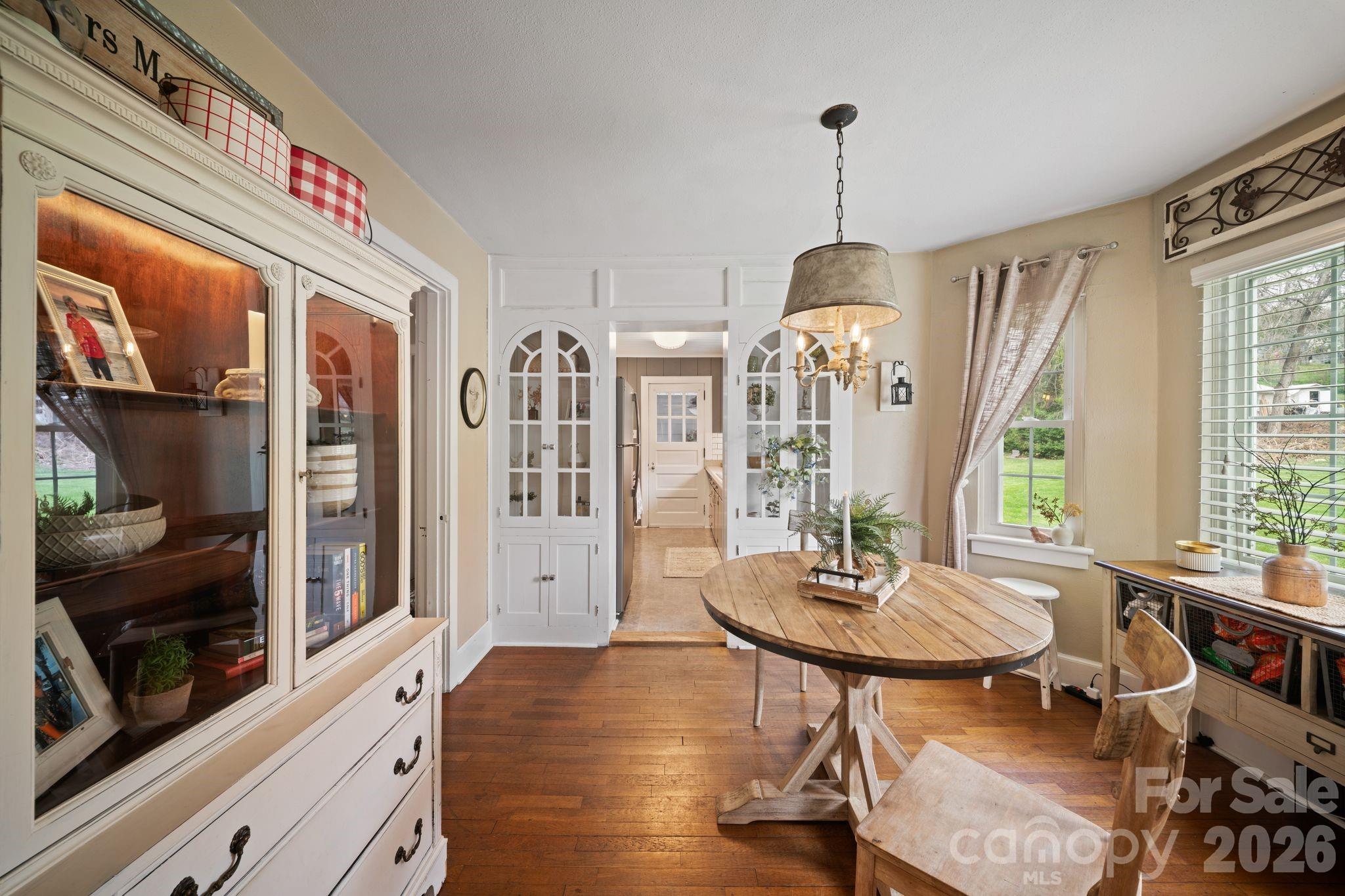 121 Johnson Street Canton, NC 28716 - Photo 15 of 32 a view of a dining room with furniture window and wooden floor