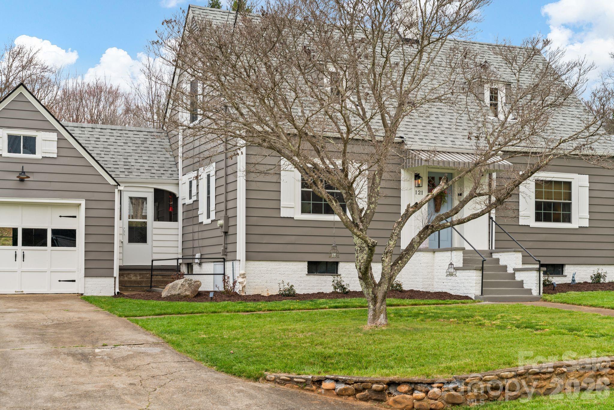 121 Johnson Street Canton, NC 28716 - Photo 2 of 32 a front view of a house with a yard