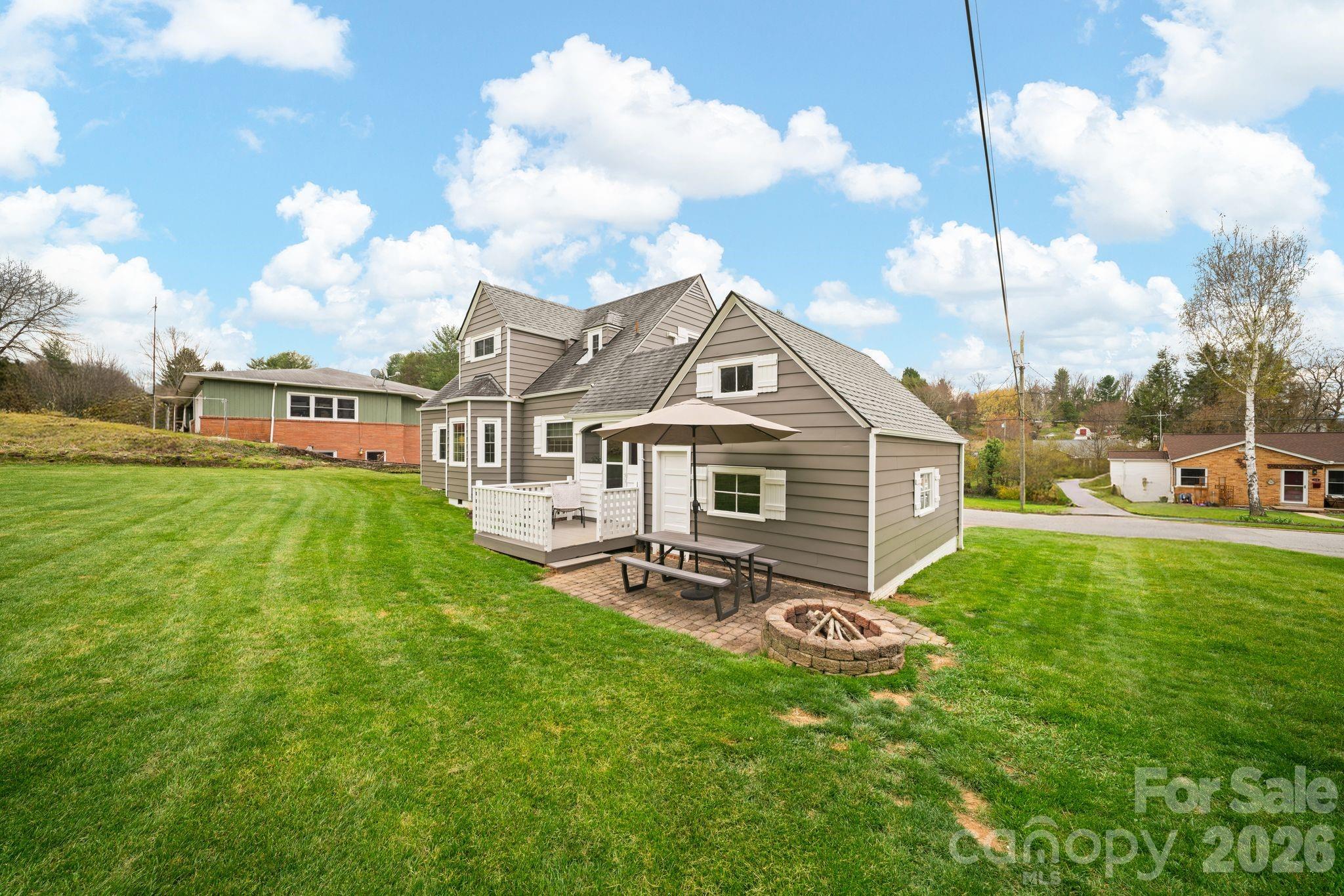 121 Johnson Street Canton, NC 28716 - Photo 29 of 32 a view of a house with a yard