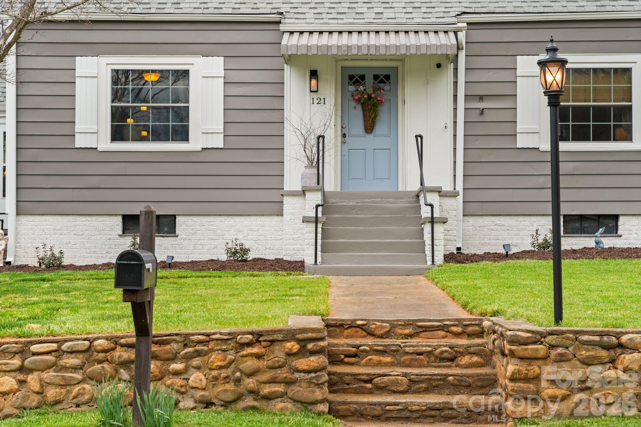 121 Johnson Street Canton, NC 28716 - Photo 3 of 32 a view of a house with backyard and porch