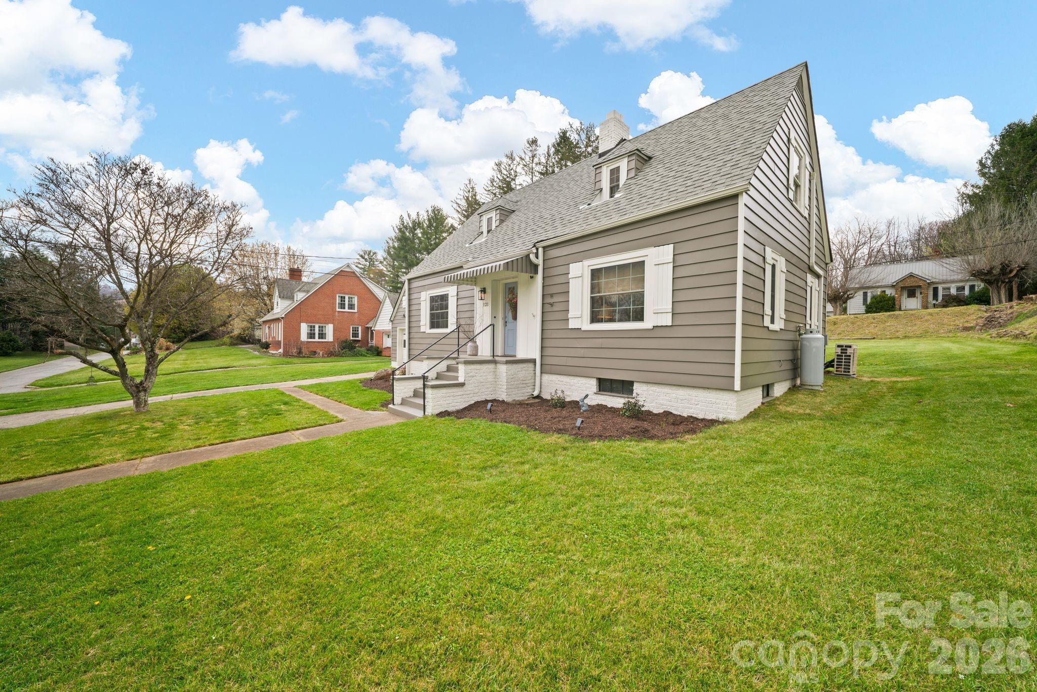 121 Johnson Street Canton, NC 28716 - Photo 5 of 32 a view of house with backyard