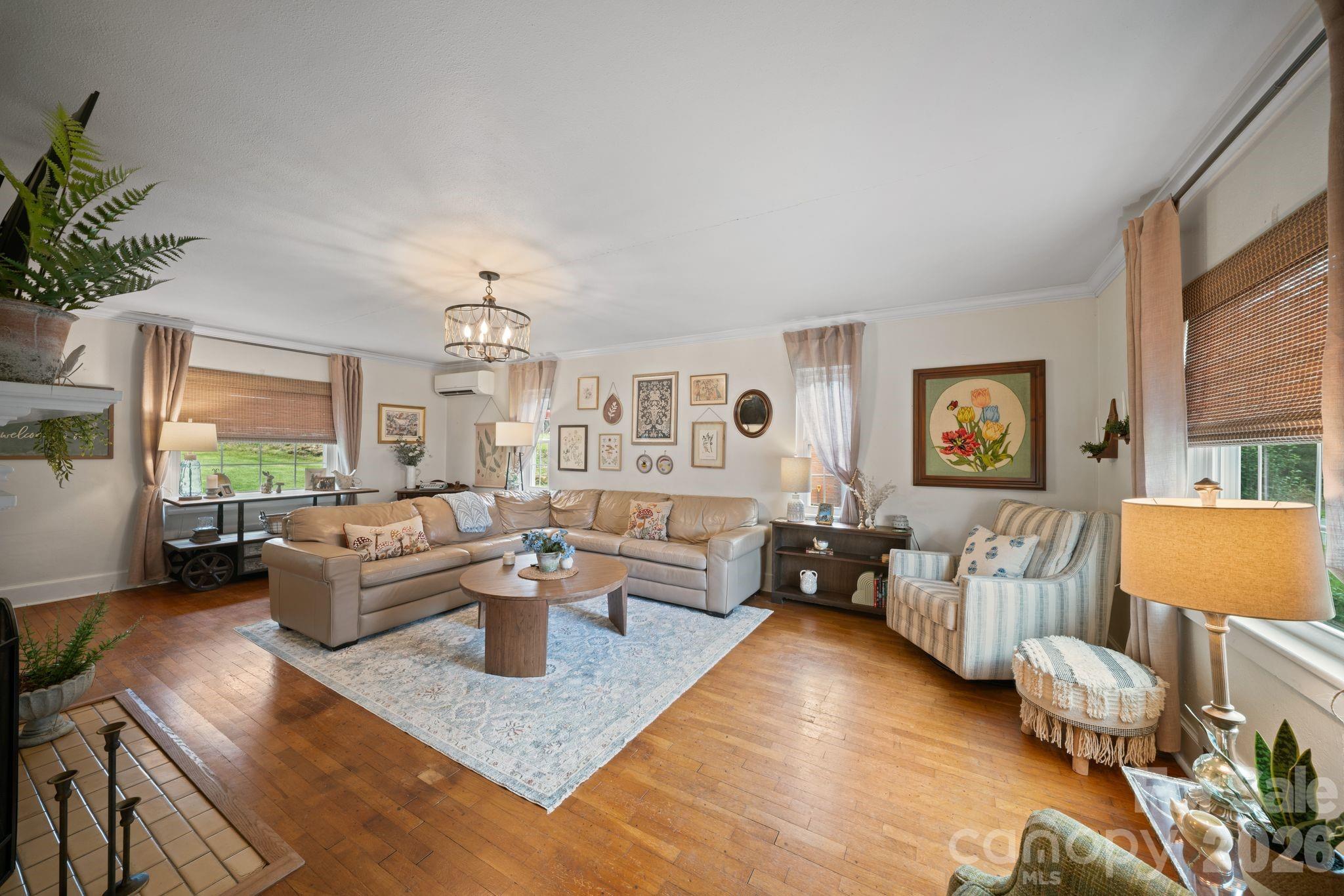 121 Johnson Street Canton, NC 28716 - Photo 7 of 32 a living room with furniture and a wooden floor