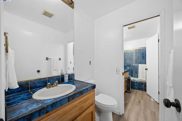 a bathroom with a sink a mirror and a shower