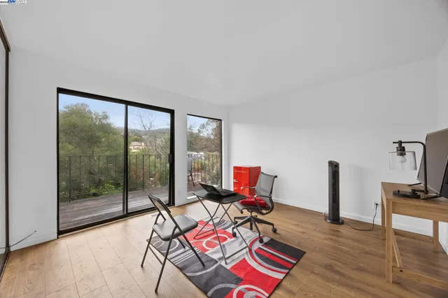 a bathroom with a granite countertop sink a toilet and a shower