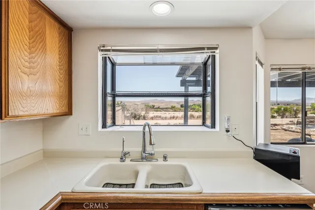 a bathroom with a bathtub and a window
