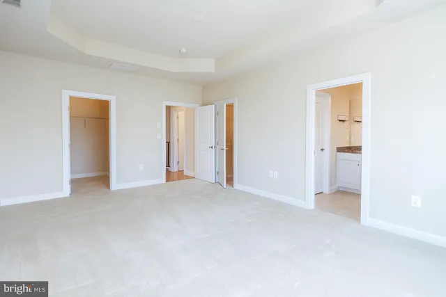 a view of empty room with closet
