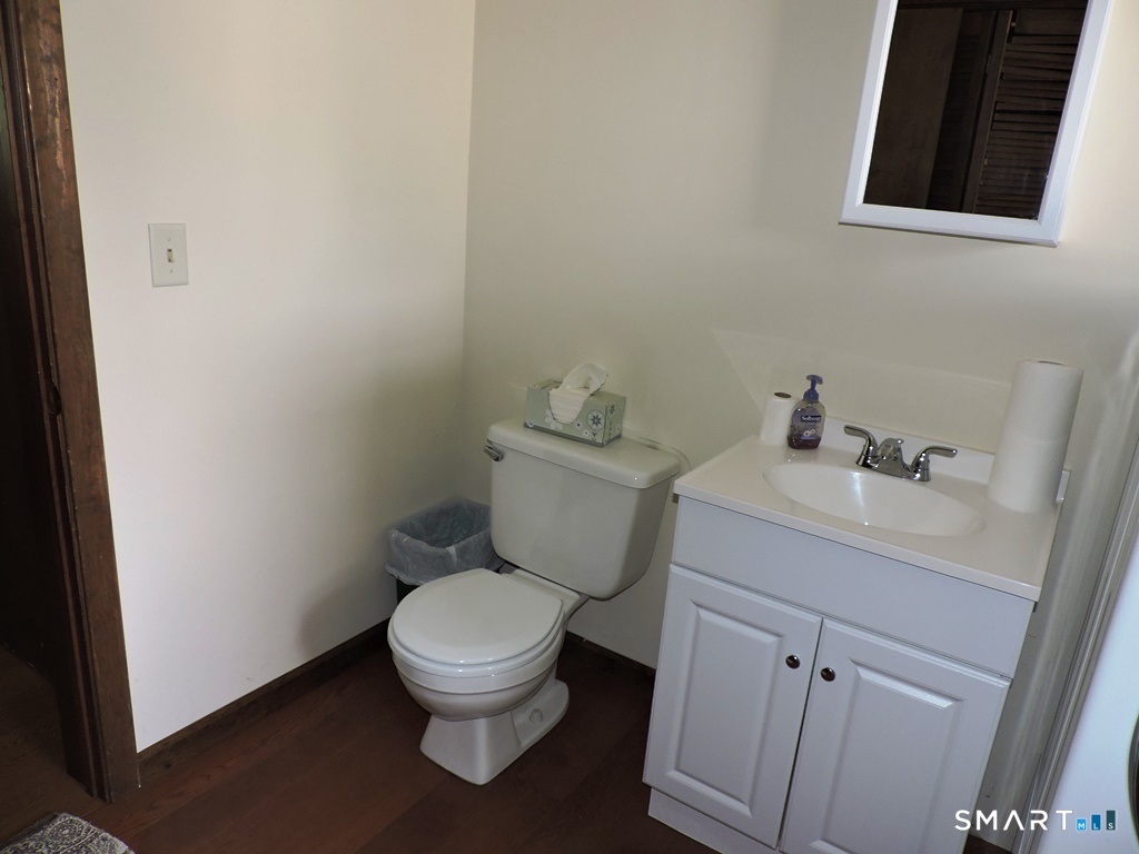 269 Griffin Road South Windsor, CT 06074 - Photo 21 of 36 a white toilet sitting next to a bathroom sink