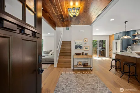 a view of a hallway with seating area