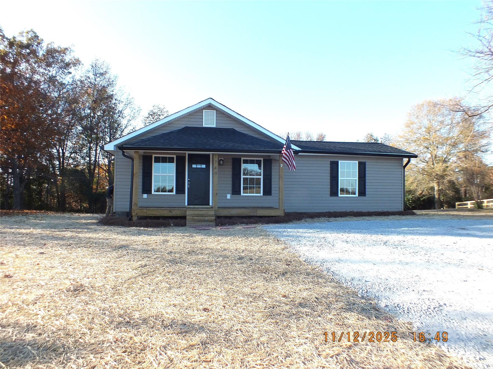 1740 Rocky River Road Lancaster, SC 29720 - Photo 1 of 31 a front view of a house with a yard