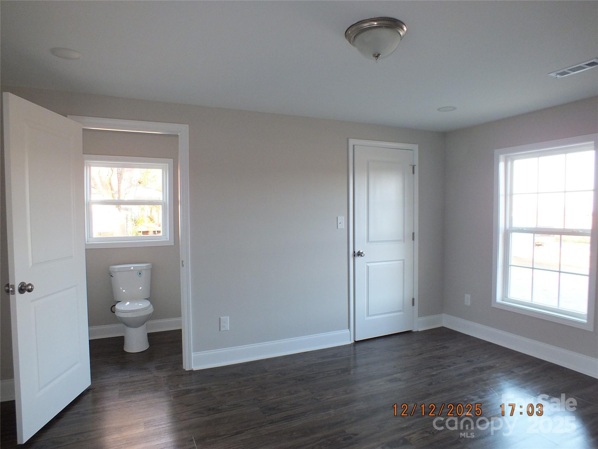 1740 Rocky River Road Lancaster, SC 29720 - Photo 12 of 31 a view of an empty room with a window and wooden floor